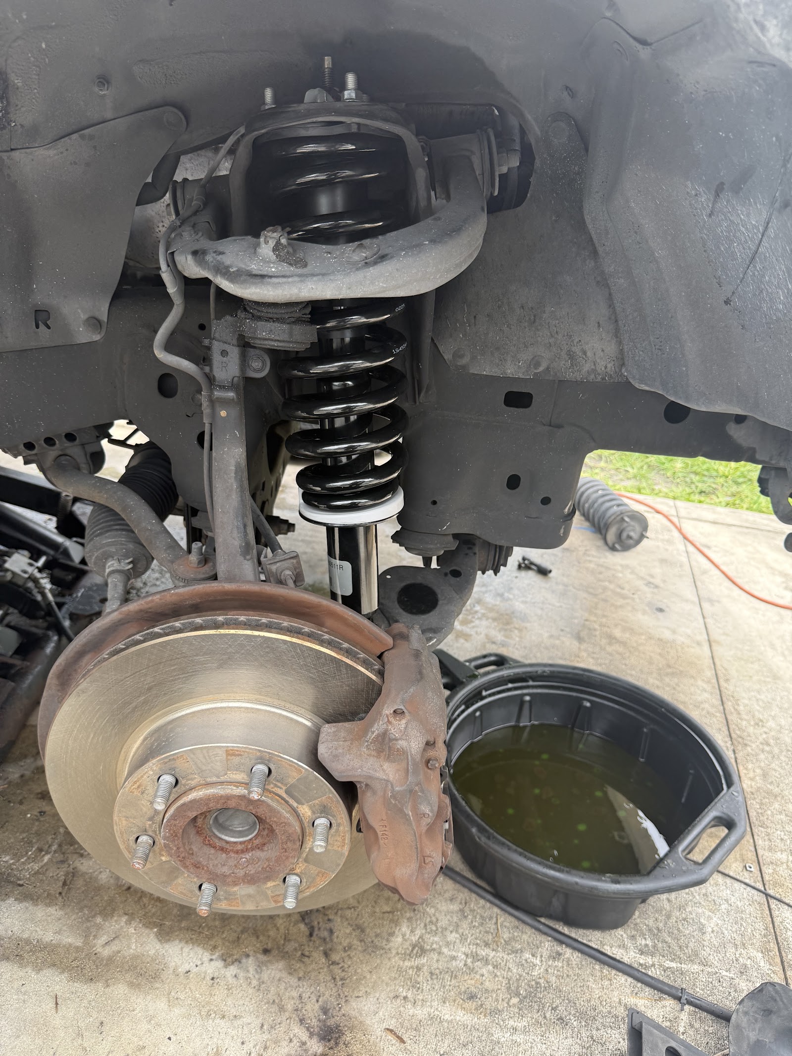Auto repair work being done at Greaseball Auto Repair, Hialeah